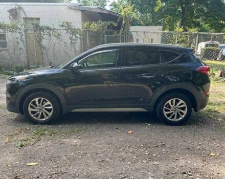 Черный Хендай Туксон, объемом двигателя 2 л и пробегом 83 тыс. км за 4400 $, фото 5 на Automoto.ua
