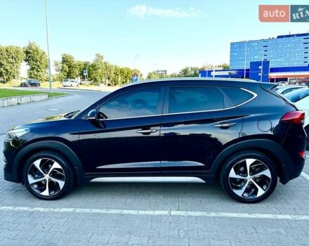Черный Хендай Туксон, объемом двигателя 2 л и пробегом 98 тыс. км за 24000 $, фото 6 на Automoto.ua