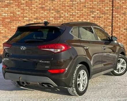 Чорний Хендай Туксон, об'ємом двигуна 2 л та пробігом 131 тис. км за 10400 $, фото 4 на Automoto.ua