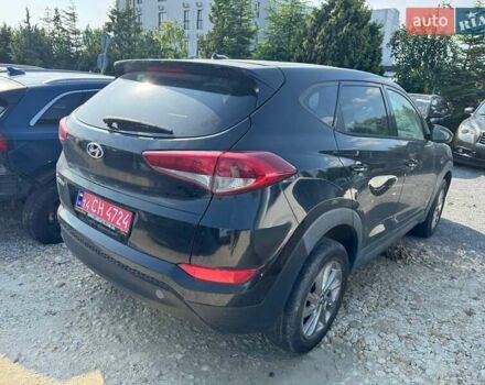 Чорний Хендай Туксон, об'ємом двигуна 2 л та пробігом 119 тис. км за 11700 $, фото 3 на Automoto.ua