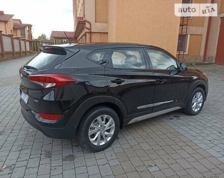 Черный Хендай Туксон, объемом двигателя 2 л и пробегом 107 тыс. км за 14800 $, фото 4 на Automoto.ua