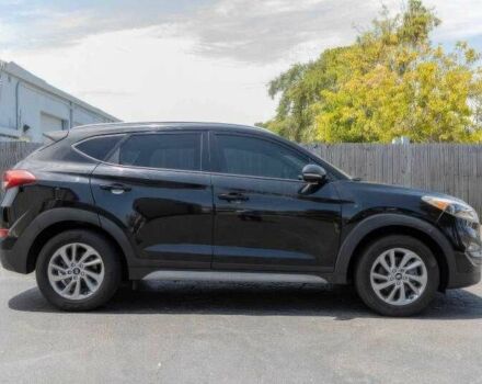 Черный Хендай Туксон, объемом двигателя 2 л и пробегом 89 тыс. км за 11200 $, фото 1 на Automoto.ua