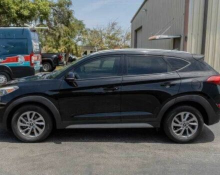 Черный Хендай Туксон, объемом двигателя 2 л и пробегом 89 тыс. км за 11200 $, фото 2 на Automoto.ua