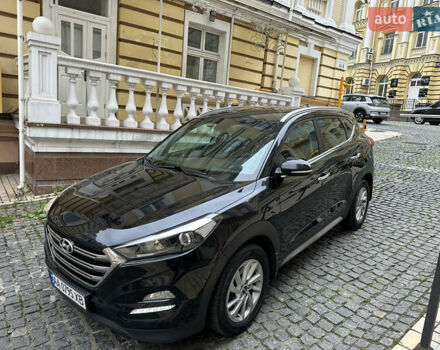 Черный Хендай Туксон, объемом двигателя 2 л и пробегом 100 тыс. км за 16900 $, фото 1 на Automoto.ua