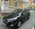 Черный Хендай Туксон, объемом двигателя 2 л и пробегом 100 тыс. км за 16900 $, фото 1 на Automoto.ua