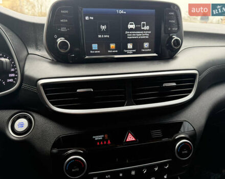 Черный Хендай Туксон, объемом двигателя 2 л и пробегом 70 тыс. км за 23000 $, фото 1 на Automoto.ua