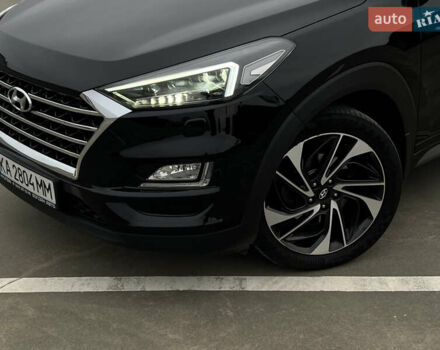 Чорний Хендай Туксон, об'ємом двигуна 2 л та пробігом 145 тис. км за 23900 $, фото 2 на Automoto.ua