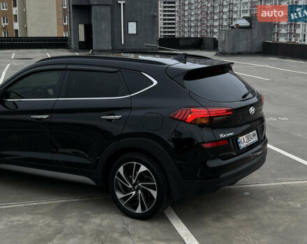 Чорний Хендай Туксон, об'ємом двигуна 2 л та пробігом 145 тис. км за 23900 $, фото 4 на Automoto.ua