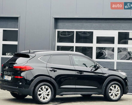Чорний Хендай Туксон, об'ємом двигуна 2 л та пробігом 84 тис. км за 19000 $, фото 4 на Automoto.ua