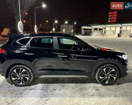 Черный Хендай Туксон, объемом двигателя 2 л и пробегом 86 тыс. км за 31000 $, фото 6 на Automoto.ua