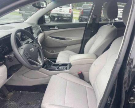 Черный Хендай Туксон, объемом двигателя 2 л и пробегом 38 тыс. км за 10400 $, фото 7 на Automoto.ua