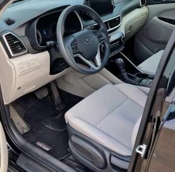 Черный Хендай Туксон, объемом двигателя 2 л и пробегом 76 тыс. км за 11200 $, фото 9 на Automoto.ua