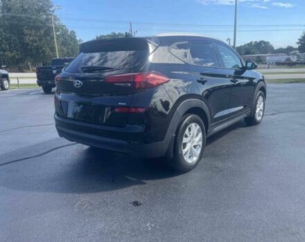 Черный Хендай Туксон, объемом двигателя 2 л и пробегом 38 тыс. км за 10400 $, фото 6 на Automoto.ua