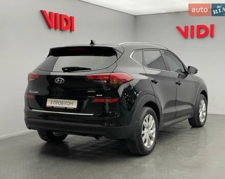 Черный Хендай Туксон, объемом двигателя 2 л и пробегом 100 тыс. км за 22424 $, фото 1 на Automoto.ua