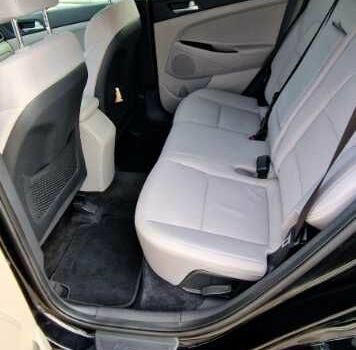 Черный Хендай Туксон, объемом двигателя 2 л и пробегом 76 тыс. км за 11200 $, фото 11 на Automoto.ua