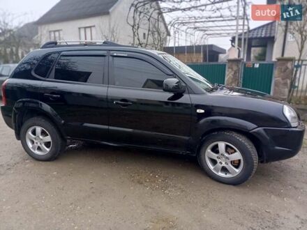 Черный Хендай Туксон, объемом двигателя 1.99 л и пробегом 302 тыс. км за 6300 $, фото 1 на Automoto.ua