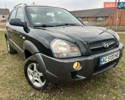 Черный Хендай Туксон, объемом двигателя 1.99 л и пробегом 275 тыс. км за 6000 $, фото 1 на Automoto.ua