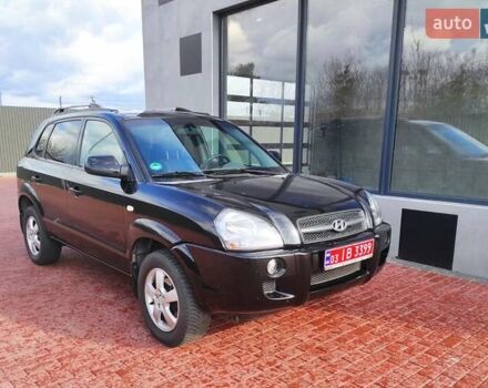 Черный Хендай Туксон, объемом двигателя 2 л и пробегом 150 тыс. км за 6750 $, фото 1 на Automoto.ua