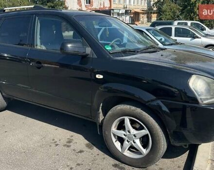 Черный Хендай Туксон, объемом двигателя 1.98 л и пробегом 225 тыс. км за 7000 $, фото 1 на Automoto.ua