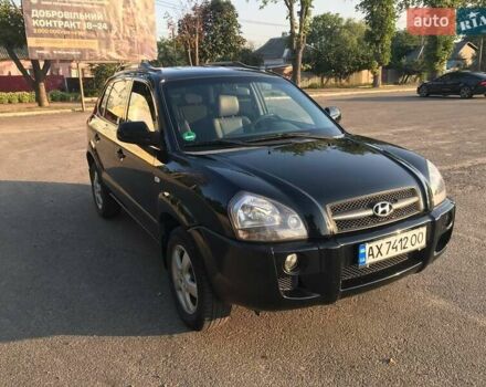 Черный Хендай Туксон, объемом двигателя 2 л и пробегом 253 тыс. км за 7500 $, фото 1 на Automoto.ua