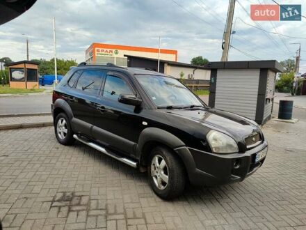 Черный Хендай Туксон, объемом двигателя 1.99 л и пробегом 250 тыс. км за 6650 $, фото 1 на Automoto.ua