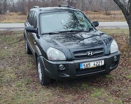 Черный Хендай Туксон, объемом двигателя 2 л и пробегом 284 тыс. км за 4700 $, фото 1 на Automoto.ua