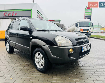 Черный Хендай Туксон, объемом двигателя 1.98 л и пробегом 252 тыс. км за 7300 $, фото 1 на Automoto.ua