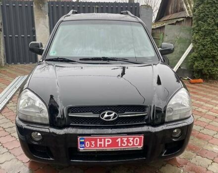 Черный Хендай Туксон, объемом двигателя 1.98 л и пробегом 202 тыс. км за 7350 $, фото 1 на Automoto.ua