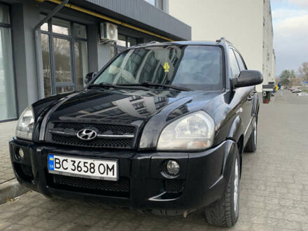 Черный Хендай Туксон, объемом двигателя 1.99 л и пробегом 290 тыс. км за 7700 $, фото 1 на Automoto.ua