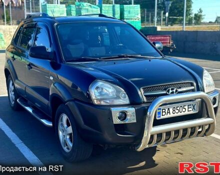 Черный Хендай Туксон, объемом двигателя 2 л и пробегом 230 тыс. км за 8700 $, фото 1 на Automoto.ua