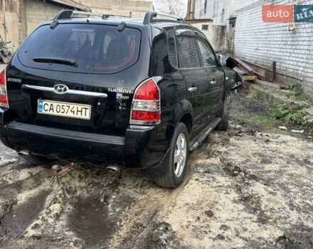 Черный Хендай Туксон, объемом двигателя 1.99 л и пробегом 250 тыс. км за 2000 $, фото 1 на Automoto.ua