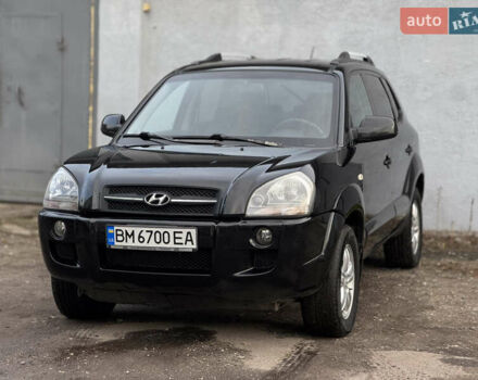 Черный Хендай Туксон, объемом двигателя 1.98 л и пробегом 198 тыс. км за 7500 $, фото 1 на Automoto.ua