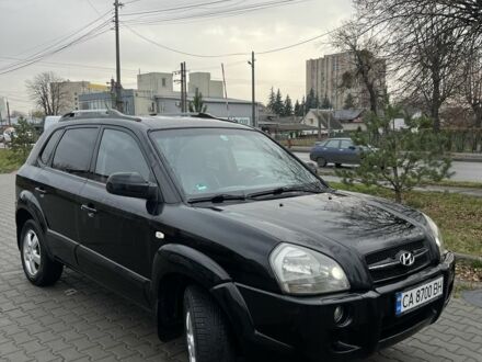 Черный Хендай Туксон, объемом двигателя 2 л и пробегом 242 тыс. км за 6999 $, фото 1 на Automoto.ua
