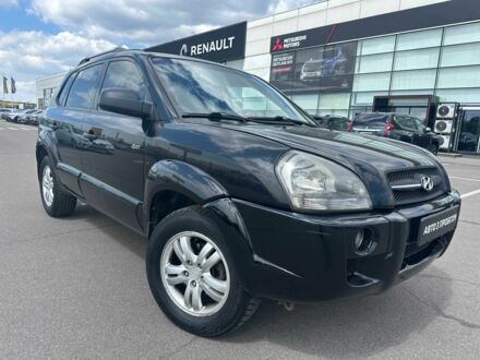 Черный Хендай Туксон, объемом двигателя 2 л и пробегом 306 тыс. км за 6900 $, фото 1 на Automoto.ua