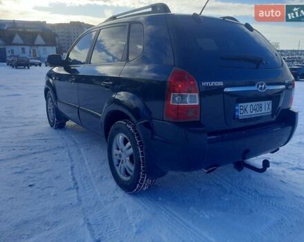 Черный Хендай Туксон, объемом двигателя 1.99 л и пробегом 295 тыс. км за 7650 $, фото 1 на Automoto.ua