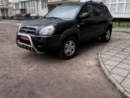 Черный Хендай Туксон, объемом двигателя 2 л и пробегом 235 тыс. км за 8000 $, фото 1 на Automoto.ua