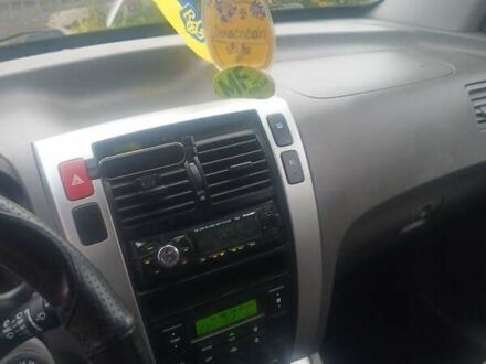 Черный Хендай Туксон, объемом двигателя 2 л и пробегом 231 тыс. км за 8000 $, фото 1 на Automoto.ua