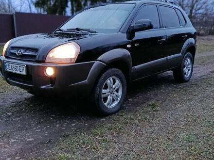 Черный Хендай Туксон, объемом двигателя 1.98 л и пробегом 253 тыс. км за 7600 $, фото 1 на Automoto.ua
