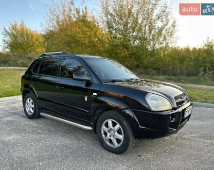 Черный Хендай Туксон, объемом двигателя 2 л и пробегом 235 тыс. км за 6700 $, фото 1 на Automoto.ua