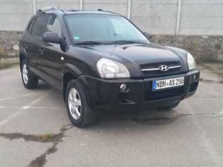 Черный Хендай Туксон, объемом двигателя 1.98 л и пробегом 155 тыс. км за 7999 $, фото 1 на Automoto.ua