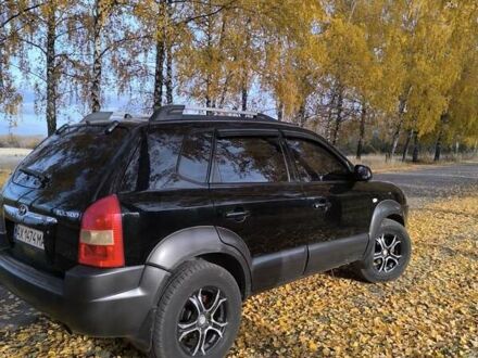 Черный Хендай Туксон, объемом двигателя 1.98 л и пробегом 230 тыс. км за 8200 $, фото 1 на Automoto.ua
