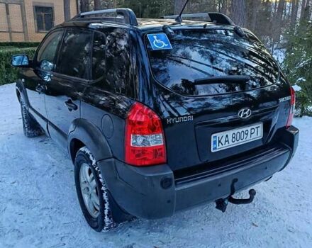 Черный Хендай Туксон, объемом двигателя 2 л и пробегом 320 тыс. км за 6900 $, фото 1 на Automoto.ua