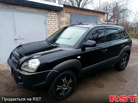 Черный Хендай Туксон, объемом двигателя 2 л и пробегом 241 тыс. км за 7200 $, фото 1 на Automoto.ua