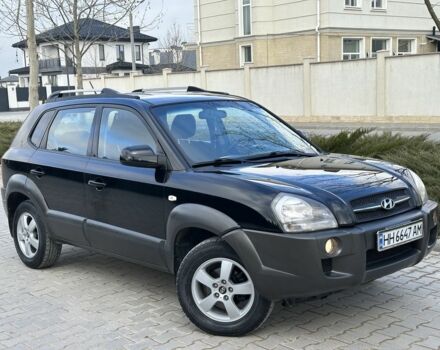 Черный Хендай Туксон, объемом двигателя 2 л и пробегом 198 тыс. км за 7499 $, фото 1 на Automoto.ua