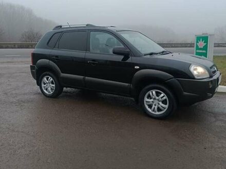Черный Хендай Туксон, объемом двигателя 2 л и пробегом 260 тыс. км за 8450 $, фото 1 на Automoto.ua