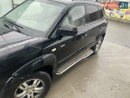 Черный Хендай Туксон, объемом двигателя 2 л и пробегом 301 тыс. км за 4500 $, фото 1 на Automoto.ua