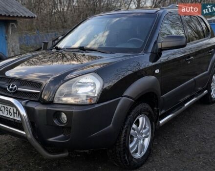 Черный Хендай Туксон, объемом двигателя 1.98 л и пробегом 230 тыс. км за 7900 $, фото 1 на Automoto.ua