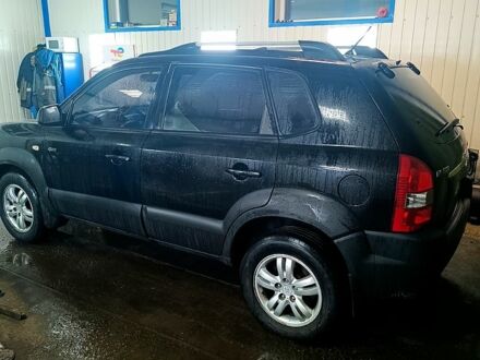 Черный Хендай Туксон, объемом двигателя 2 л и пробегом 189 тыс. км за 7999 $, фото 1 на Automoto.ua