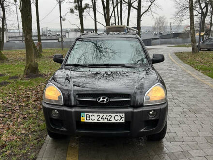 Черный Хендай Туксон, объемом двигателя 1.98 л и пробегом 400 тыс. км за 7700 $, фото 1 на Automoto.ua