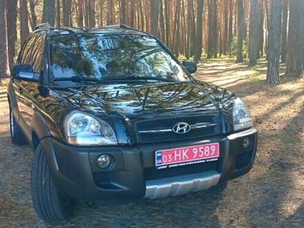 Черный Хендай Туксон, объемом двигателя 1.98 л и пробегом 236 тыс. км за 7600 $, фото 1 на Automoto.ua